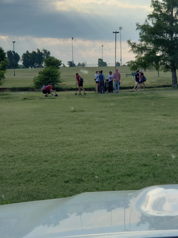 A photo of people picking up Fireworks trash