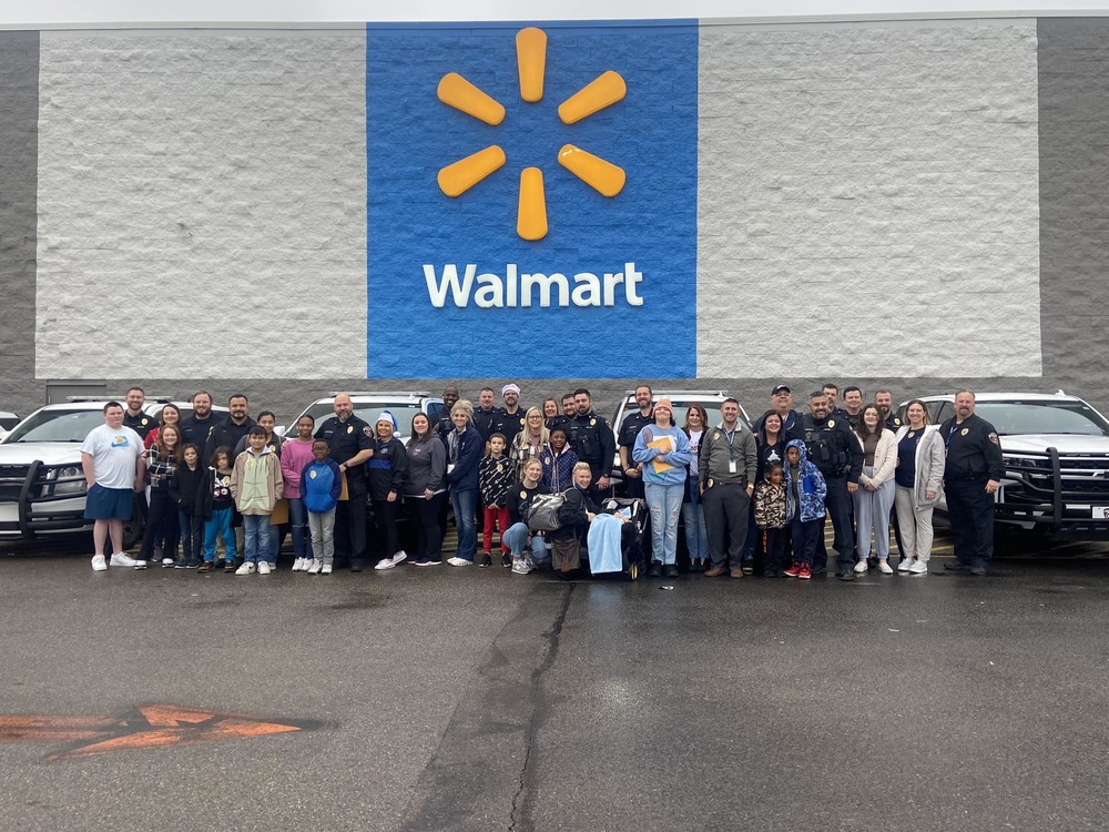large group of people in front of walmart store