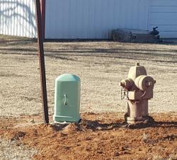 green EPA box by fire hydrant